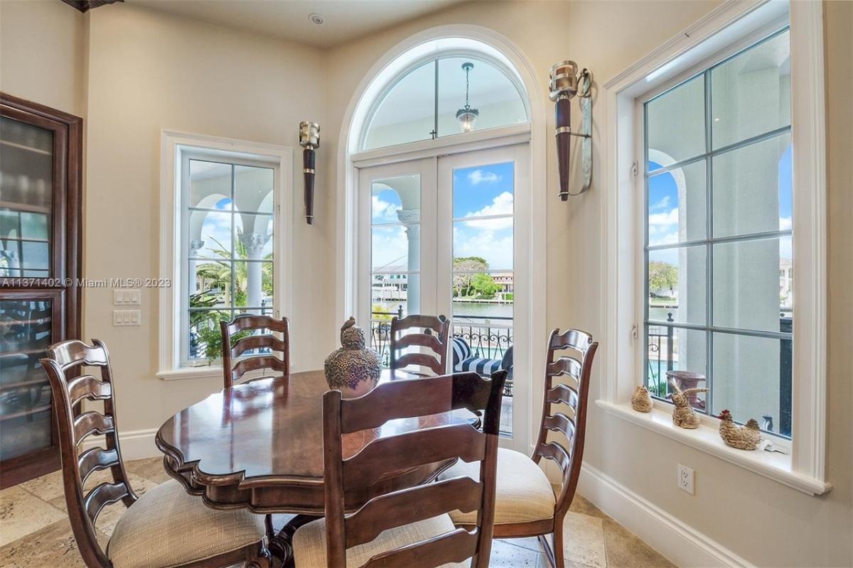 Breakfast nook with a wood table and chairs.