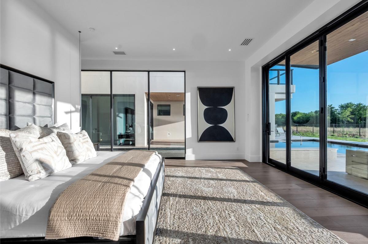 Bedroom with hardwood floors and glass doors.