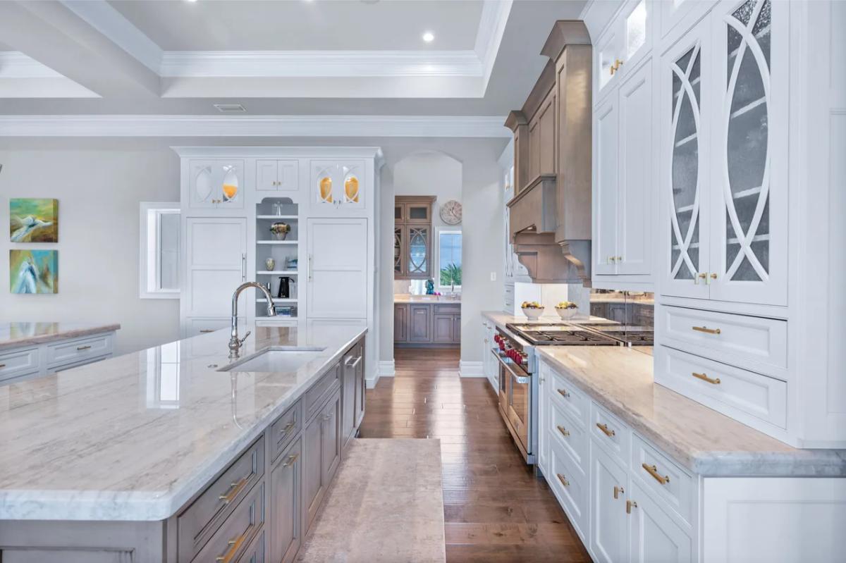 Kitchen with custom cabinetry and a center island prep area.