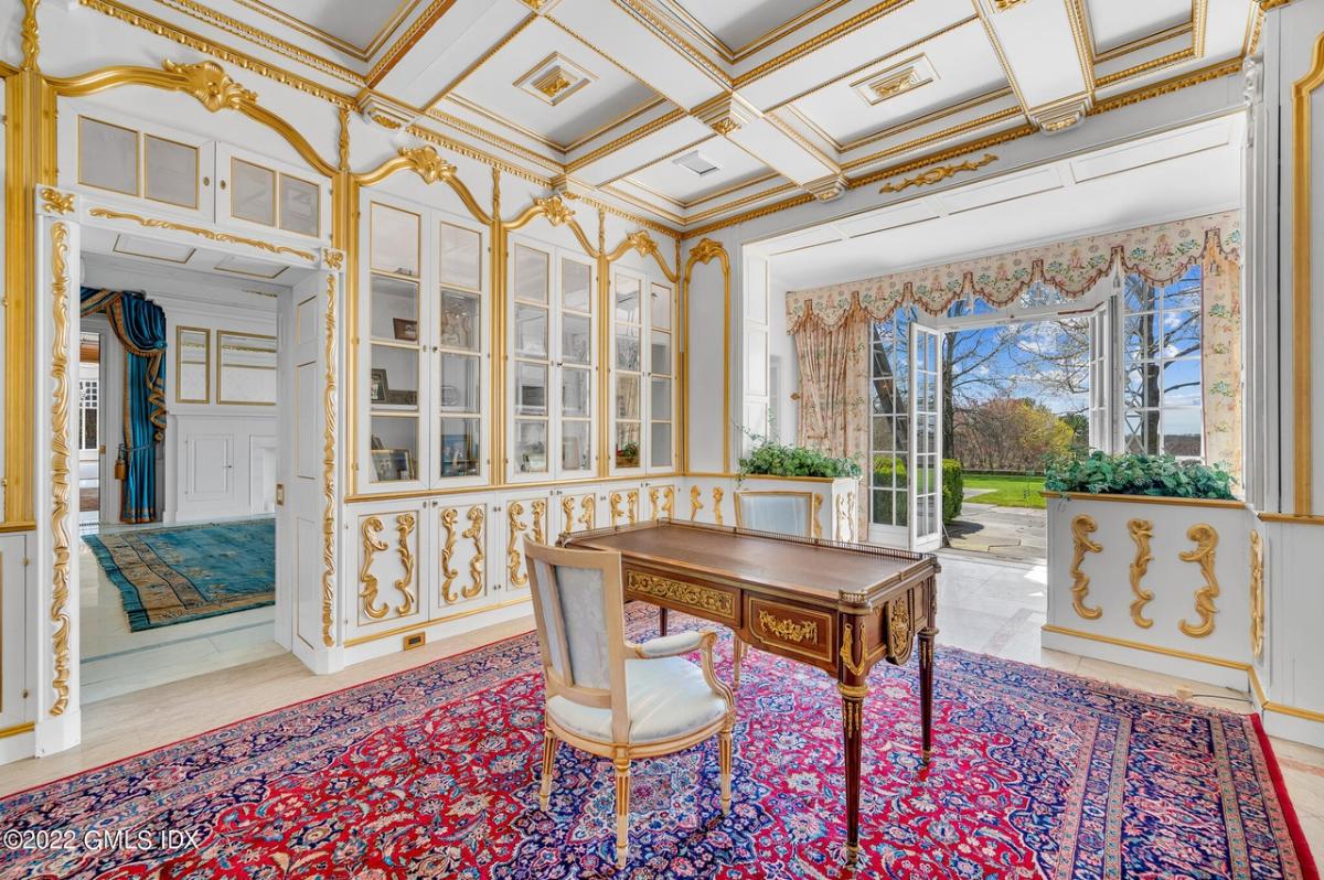 Home office with coffered ceilings.