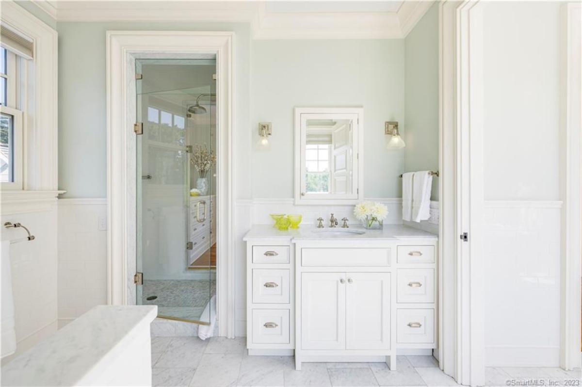 Bathroom with a custom-made vanity and a walk-in shower.