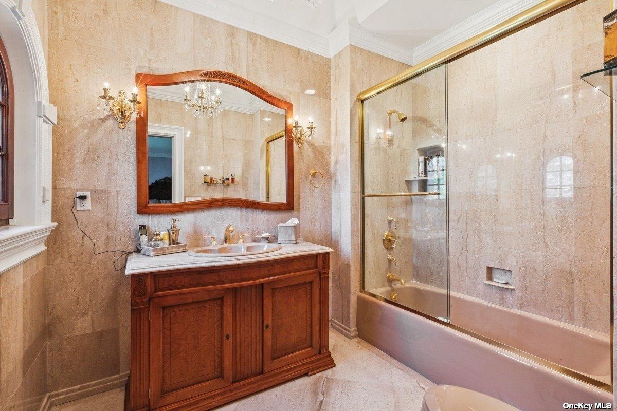 Bathroom with a sink, soaking tub and a walk-in shower.