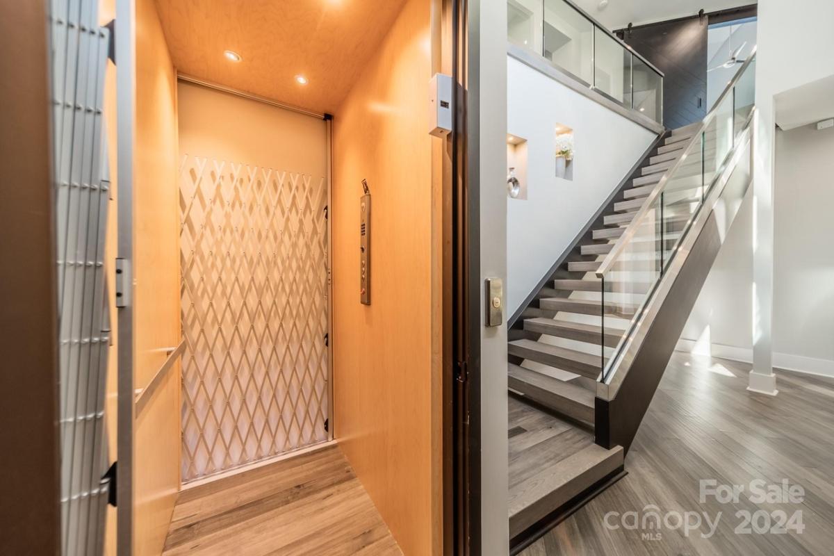 Elevator adjacent to the stairs.