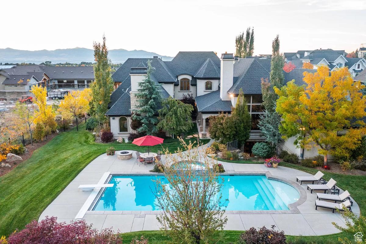 Aerial view of the mansion with a pool.