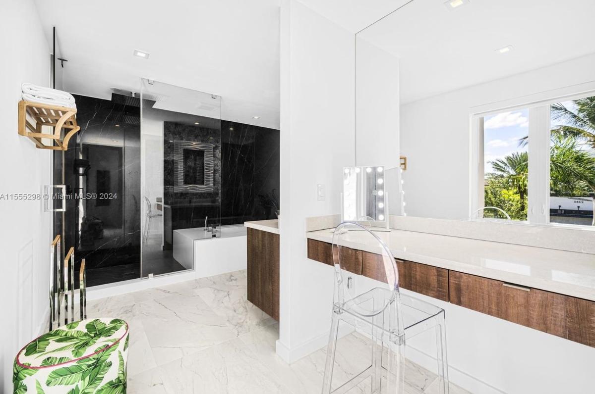 Bathroom with a soaking tub and a walk-in shower.