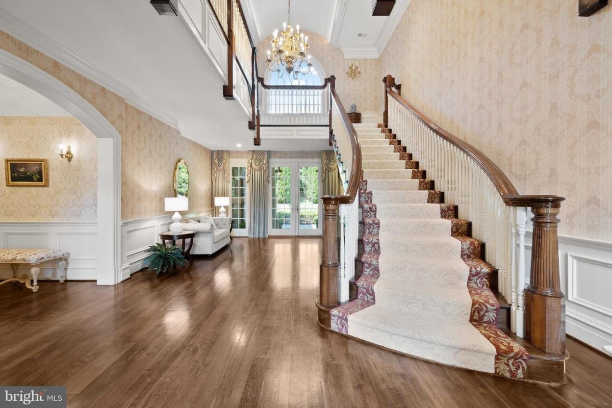Stairs with a chandelier.