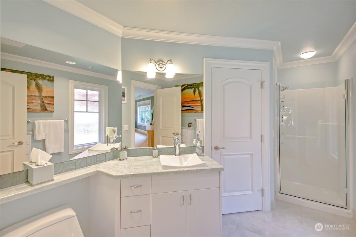 Bathroom with a sink and a walk-in shower.