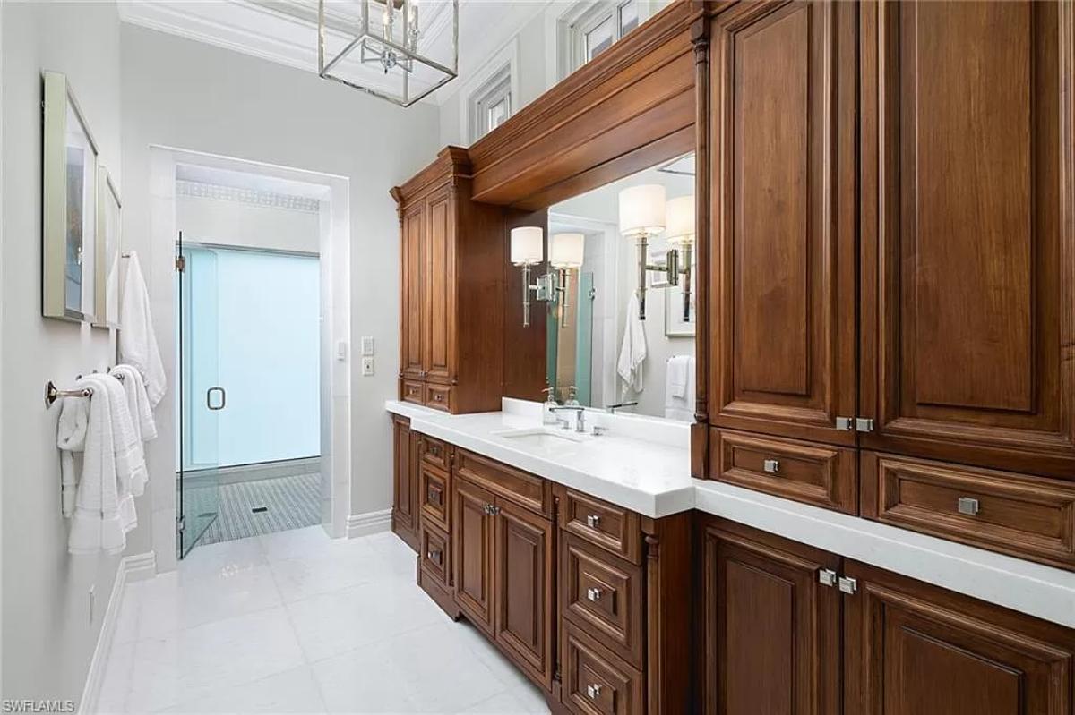 Bathroom with a custom-made vanity and a walk-in shower.