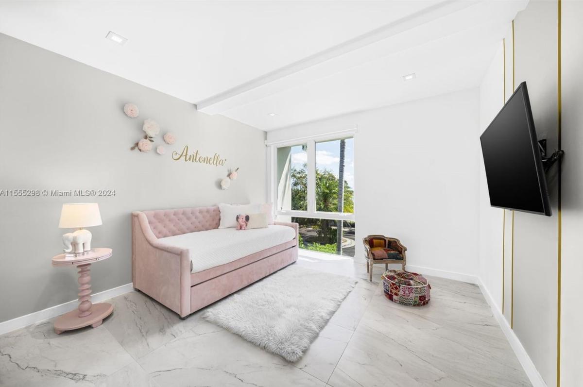 Bedroom with a custom bed and glass windows.