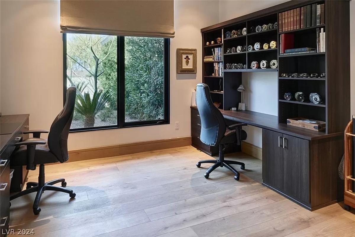 Home office with custom cabinetry.