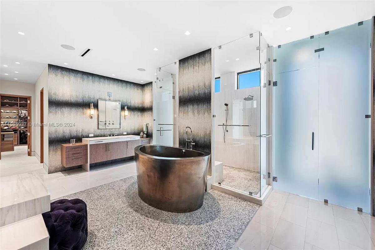 Bathroom with a sink, soaking tub and a walk-in shower.