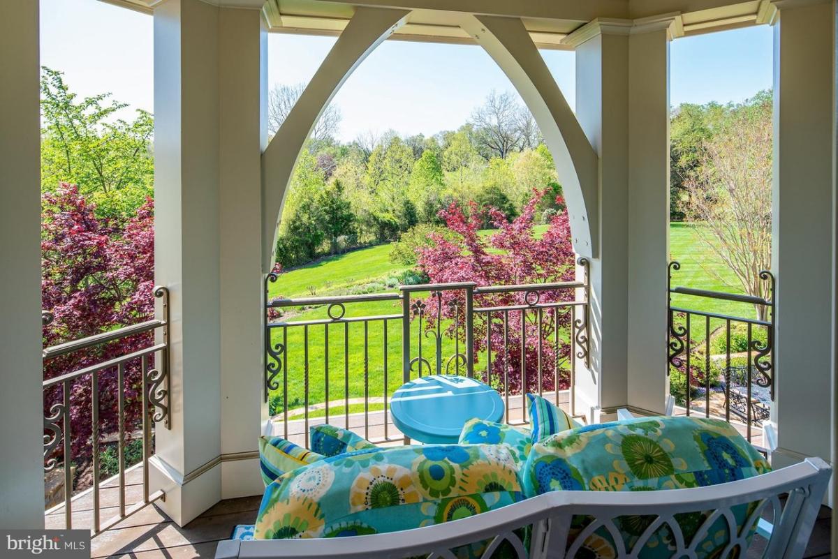 Balcony overlooking the huge green lawn.