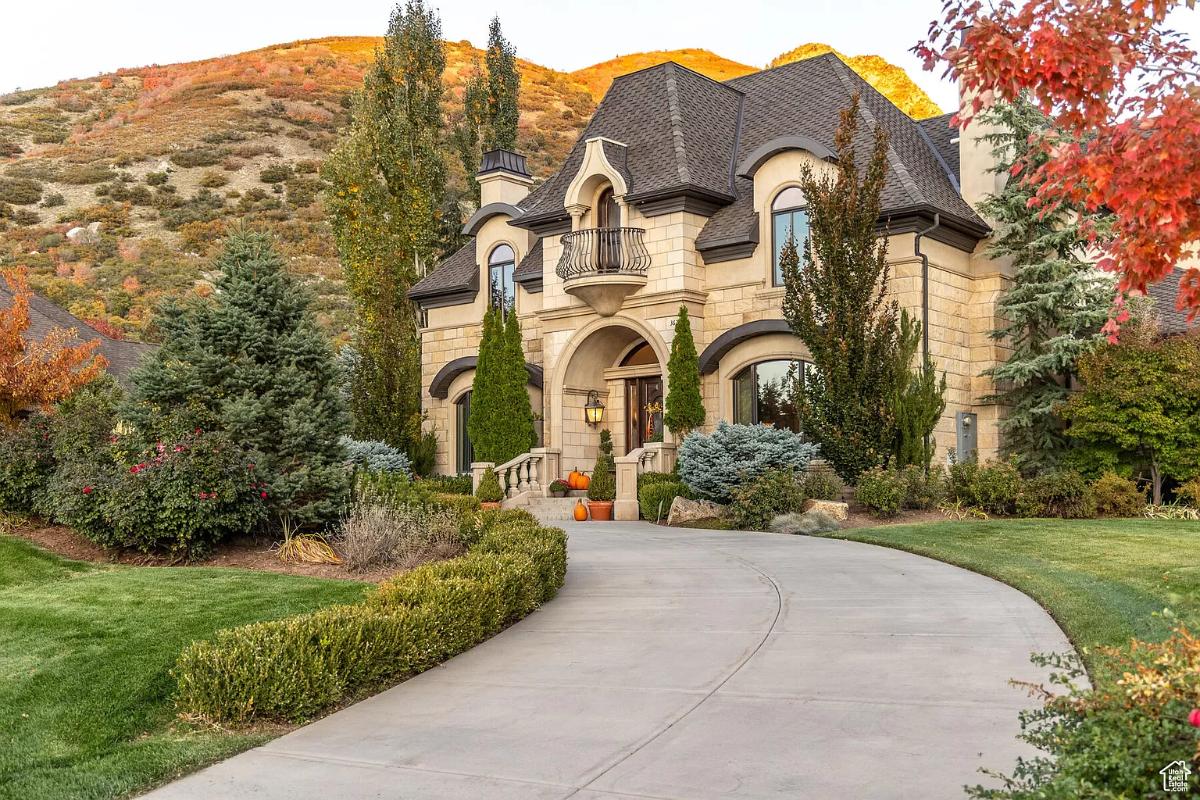 Driveway with a landscaped yard.