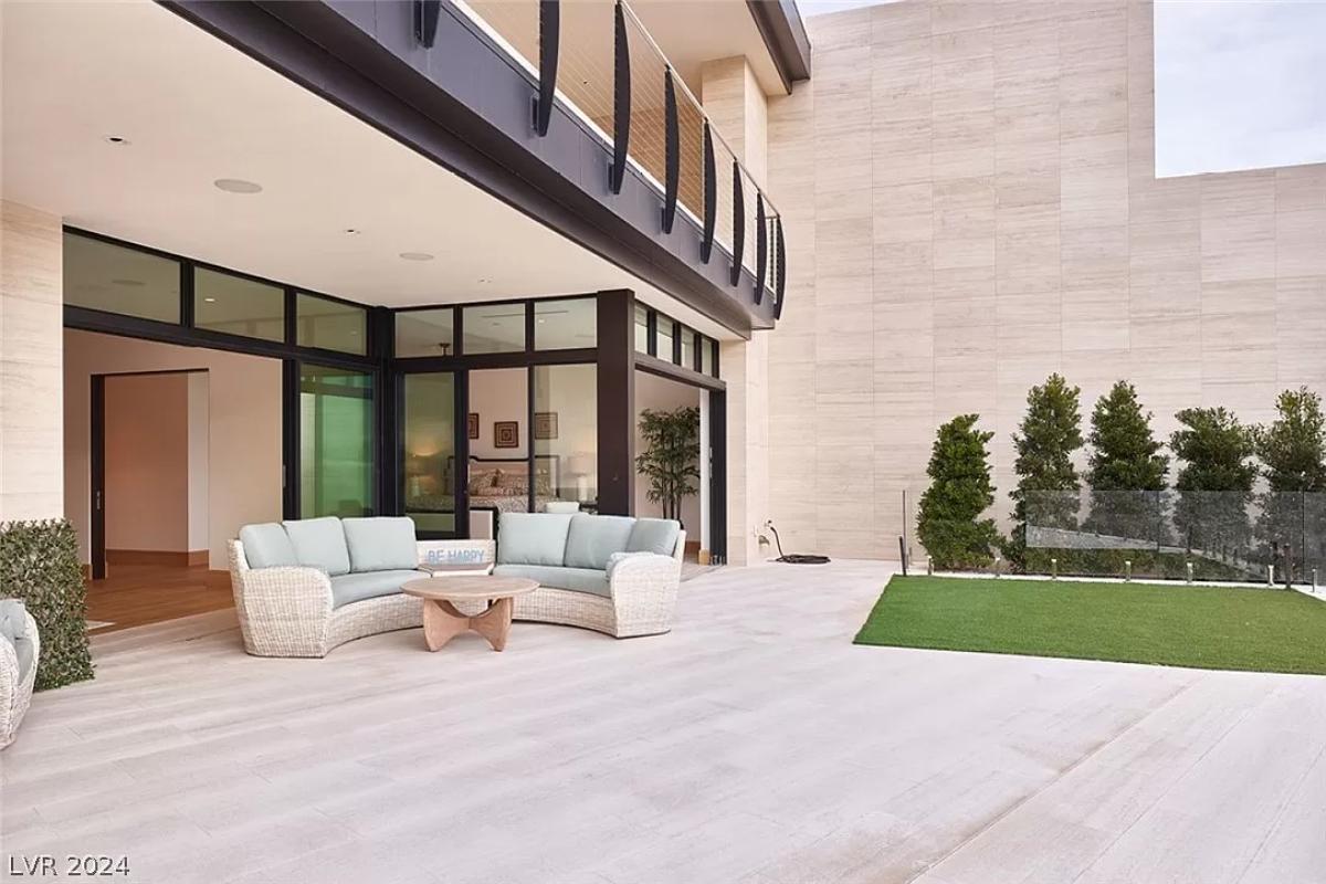 Patio with couches and a table.