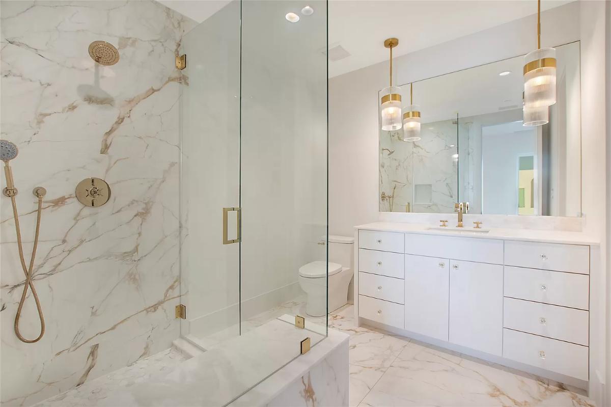 Bathroom with a custom-made vanity and a walk-in shower.