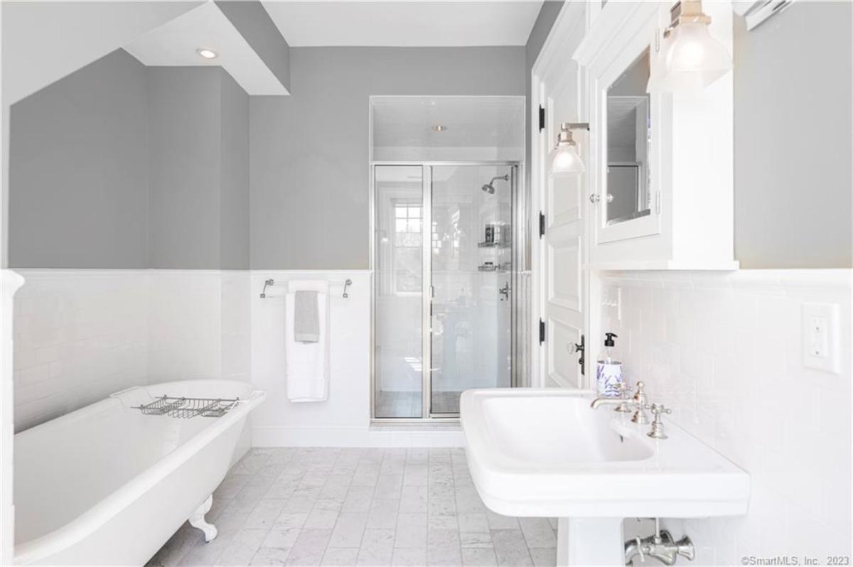 Bathroom with a sink, soaking tub and a walk-in shower.