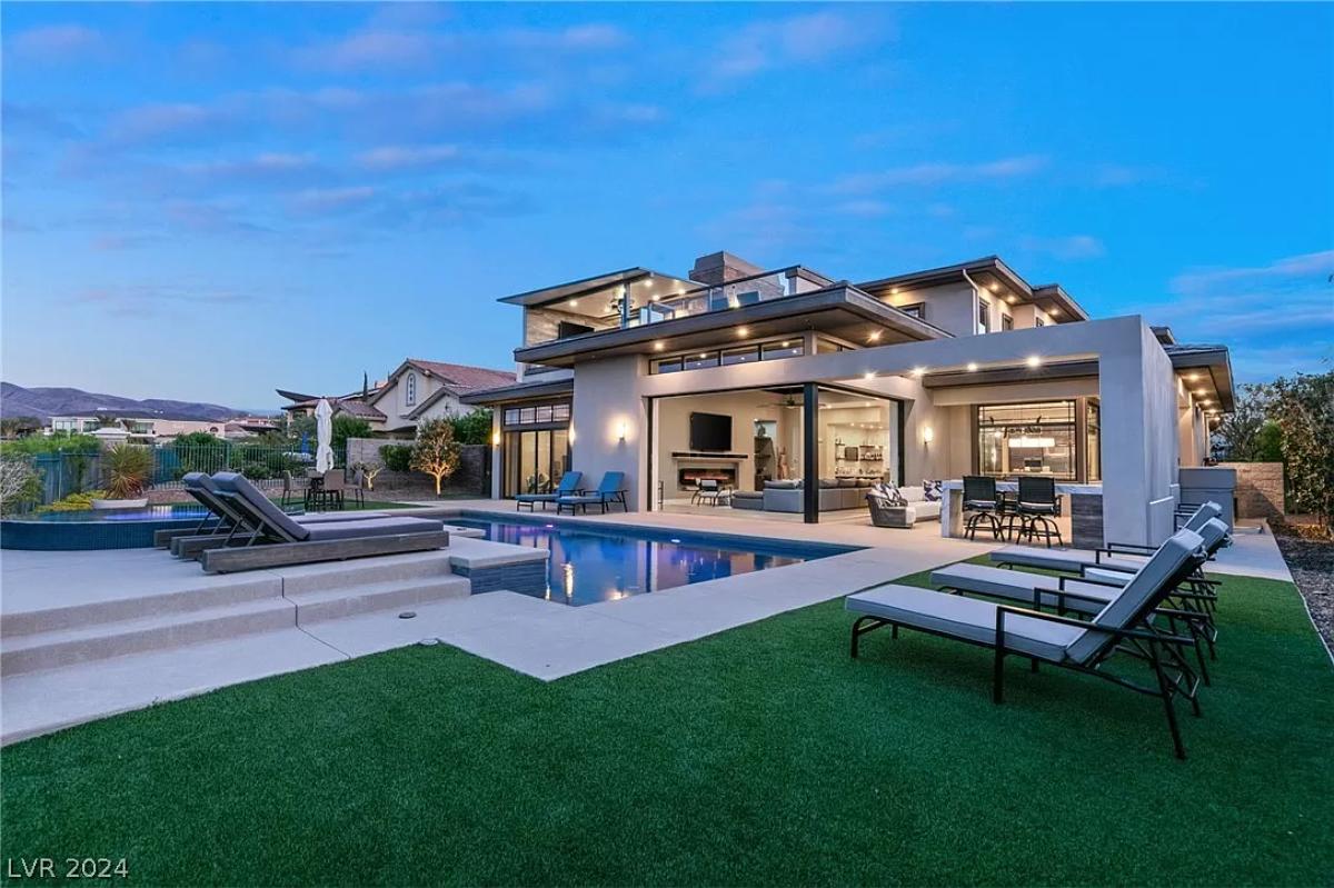 Rear view of the house with a pool.