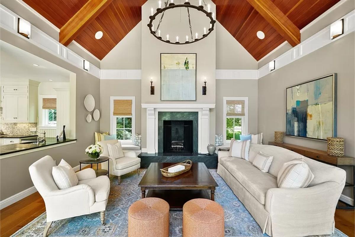 Living room with couches and a fireplace.