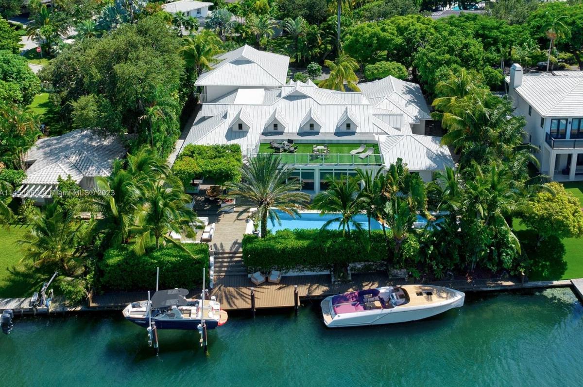 Aerial view of the property with a boat dock.