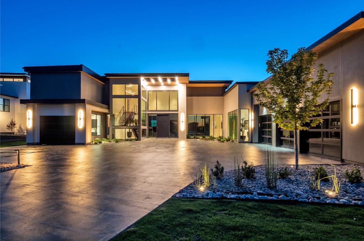 Front view of the mansion with spacious driveway.