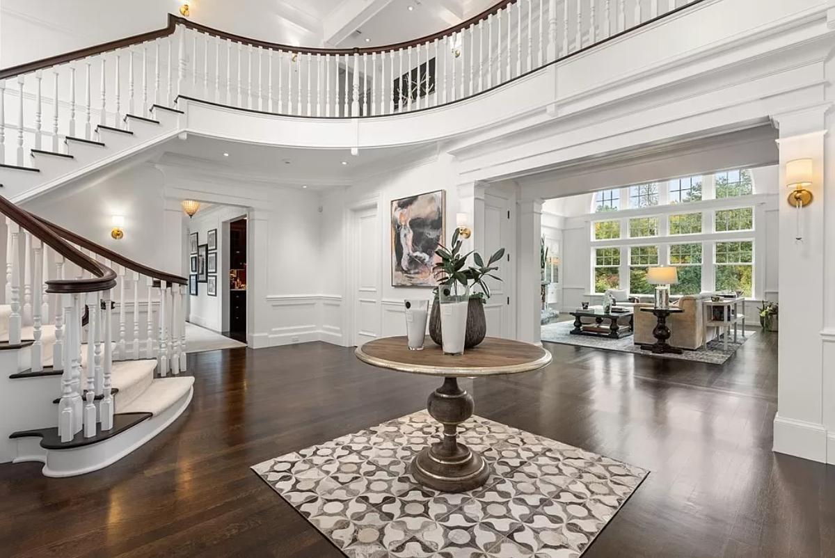 Foyer with a round wood table.