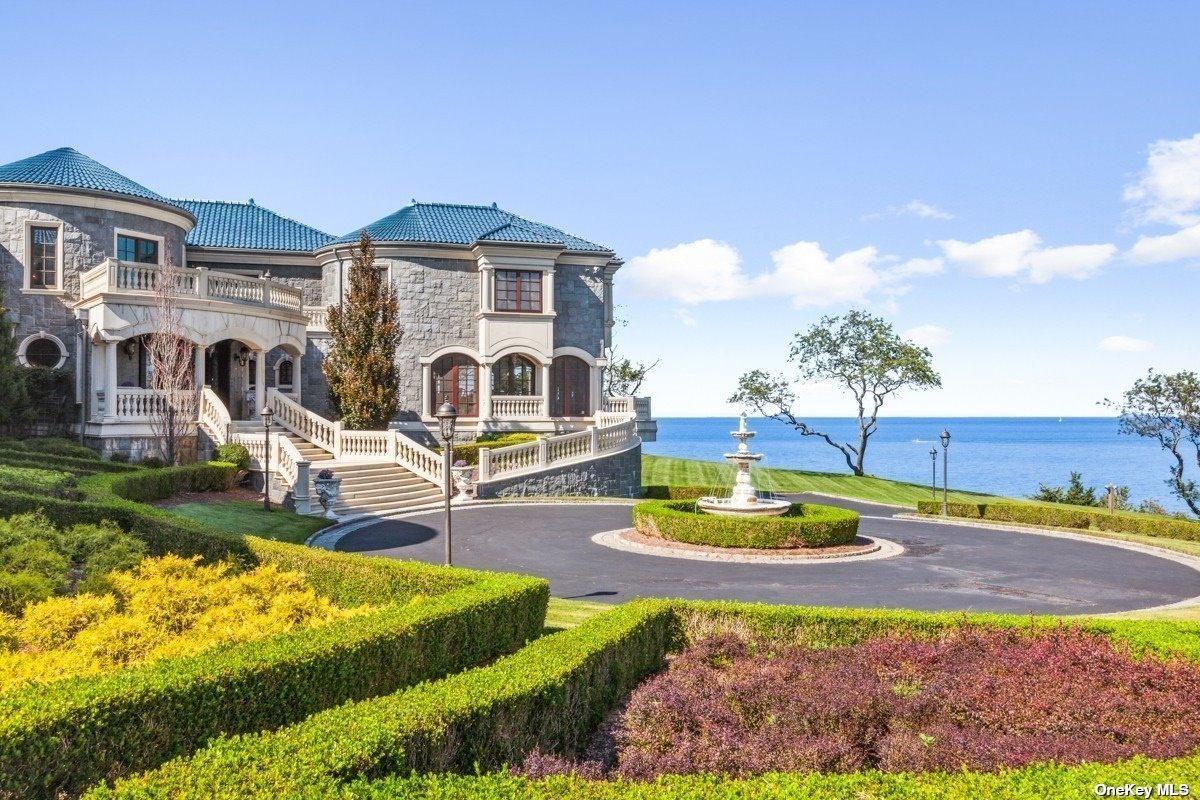 Front yard of the mansion with a fountain.