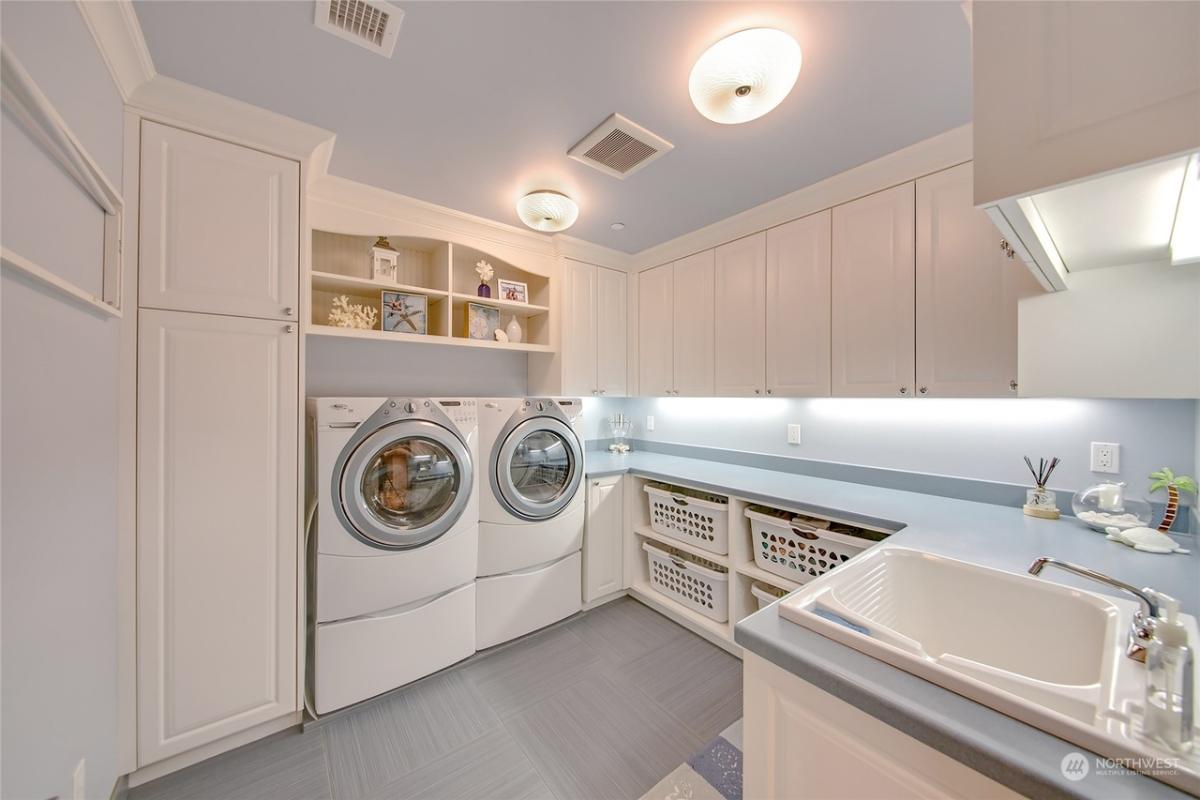 Laundry room with custom cabinetry.