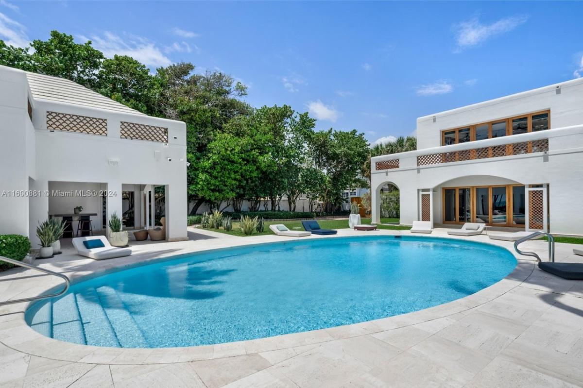 Pool with lounge chairs.