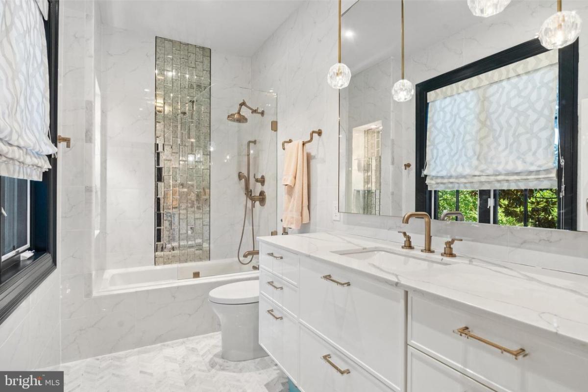 Bathroom with a sink, toilet and a shower.