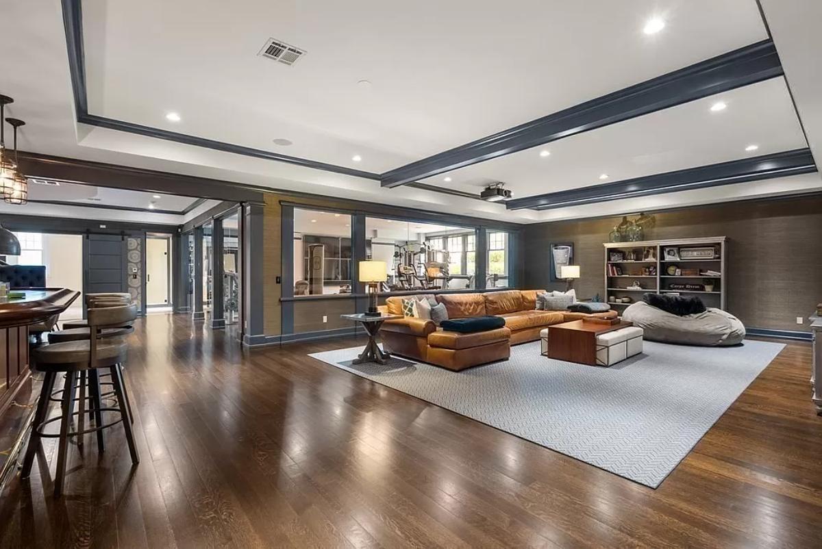 Recreational room with couches and a bar.