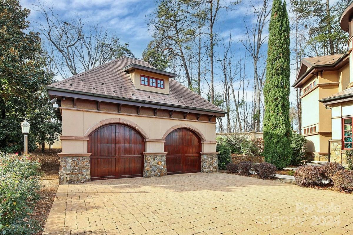 Garage with a spacious driveway.