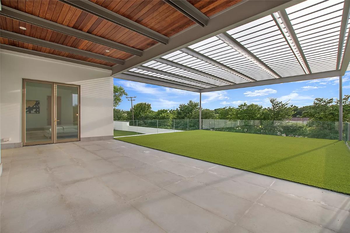 Rooftop deck with glass railings.