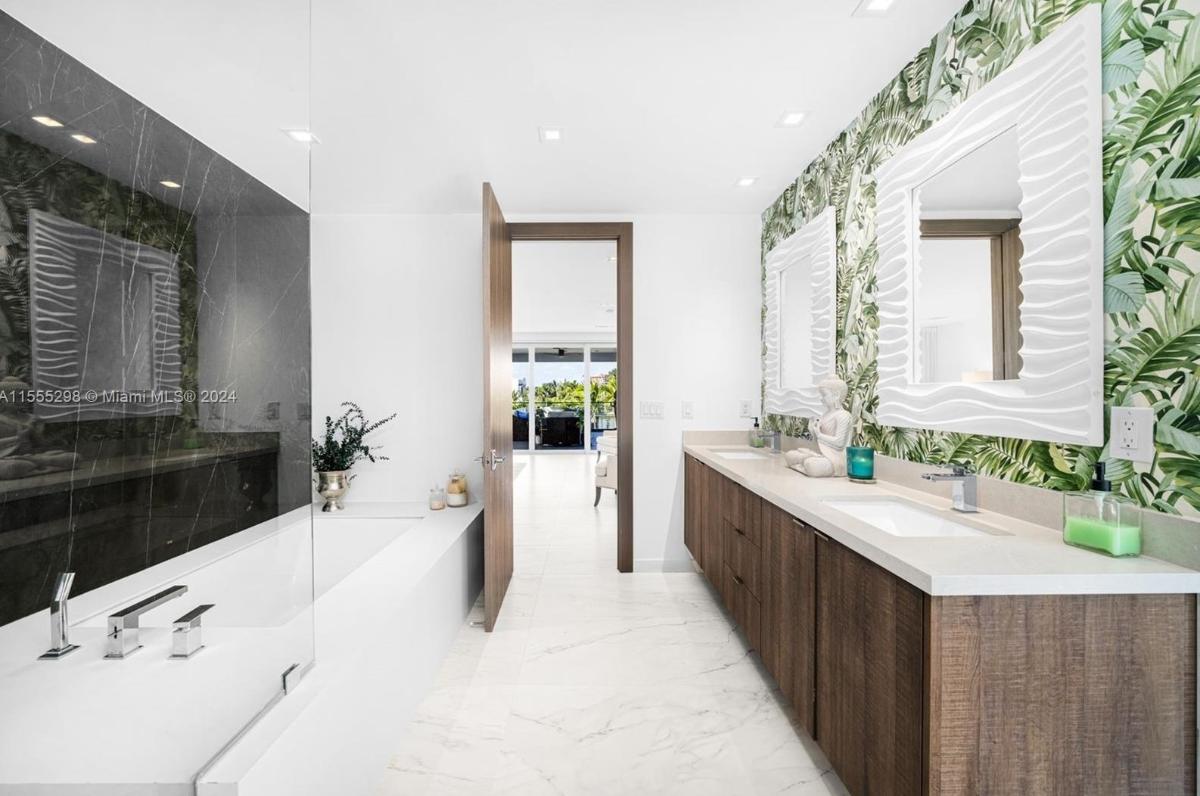 Bathroom with a custom-made vanity and a soaking tub.