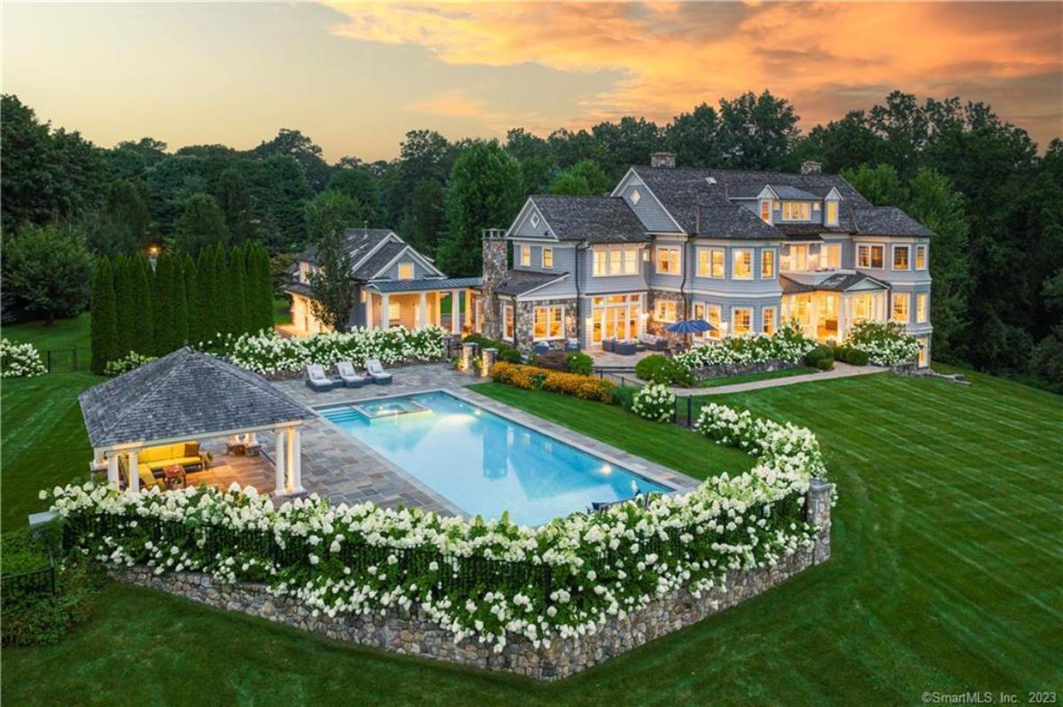 Aerial view of the mansion with a pool.