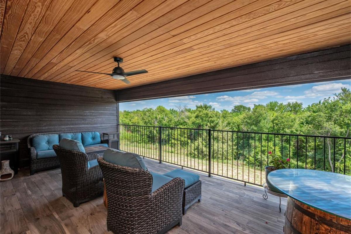 Balcony with tables and couches.