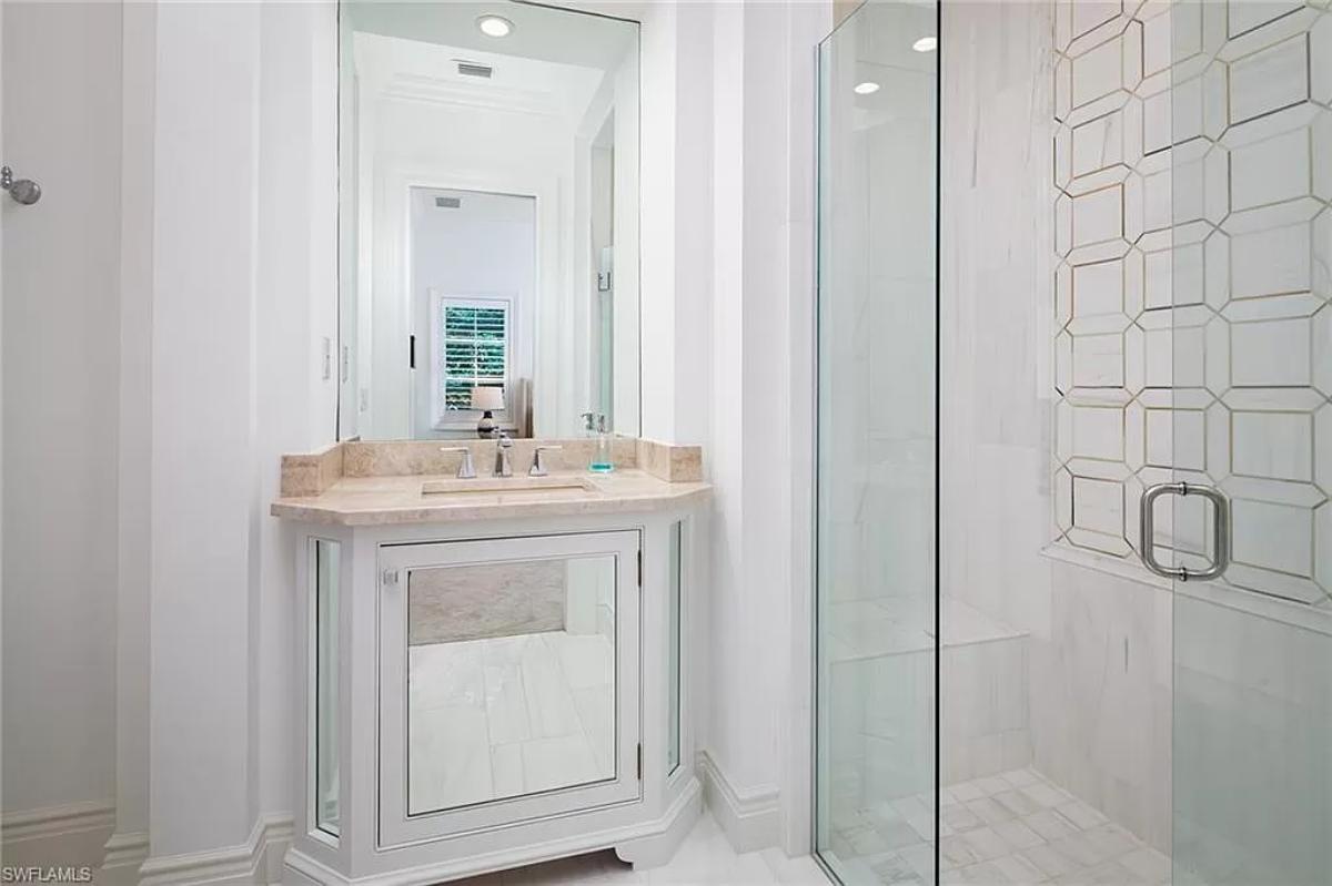 Bathroom with a sink and a walk-in shower.