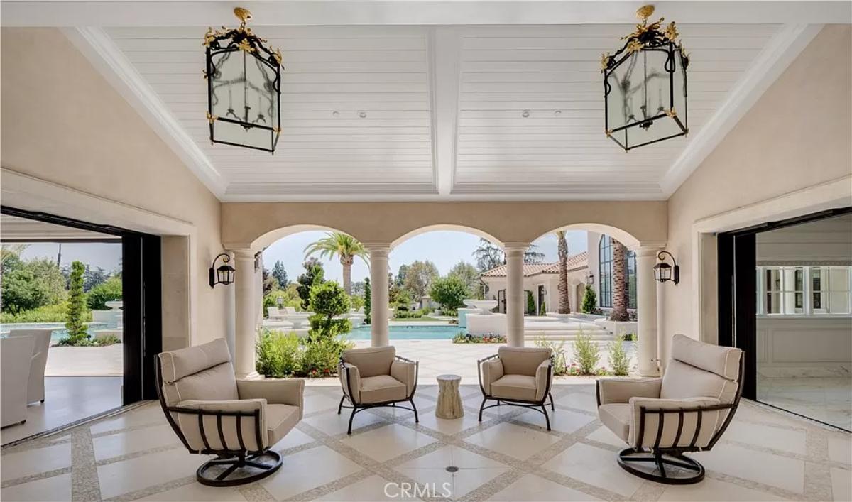 Outdoor living space overlooking the pool.