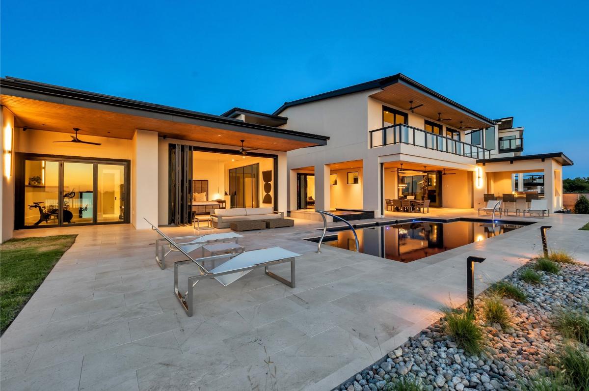 Rear view of the mansion with a pool.