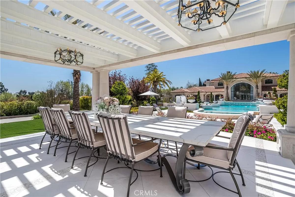Outdoor dining area adjacent to the pool.