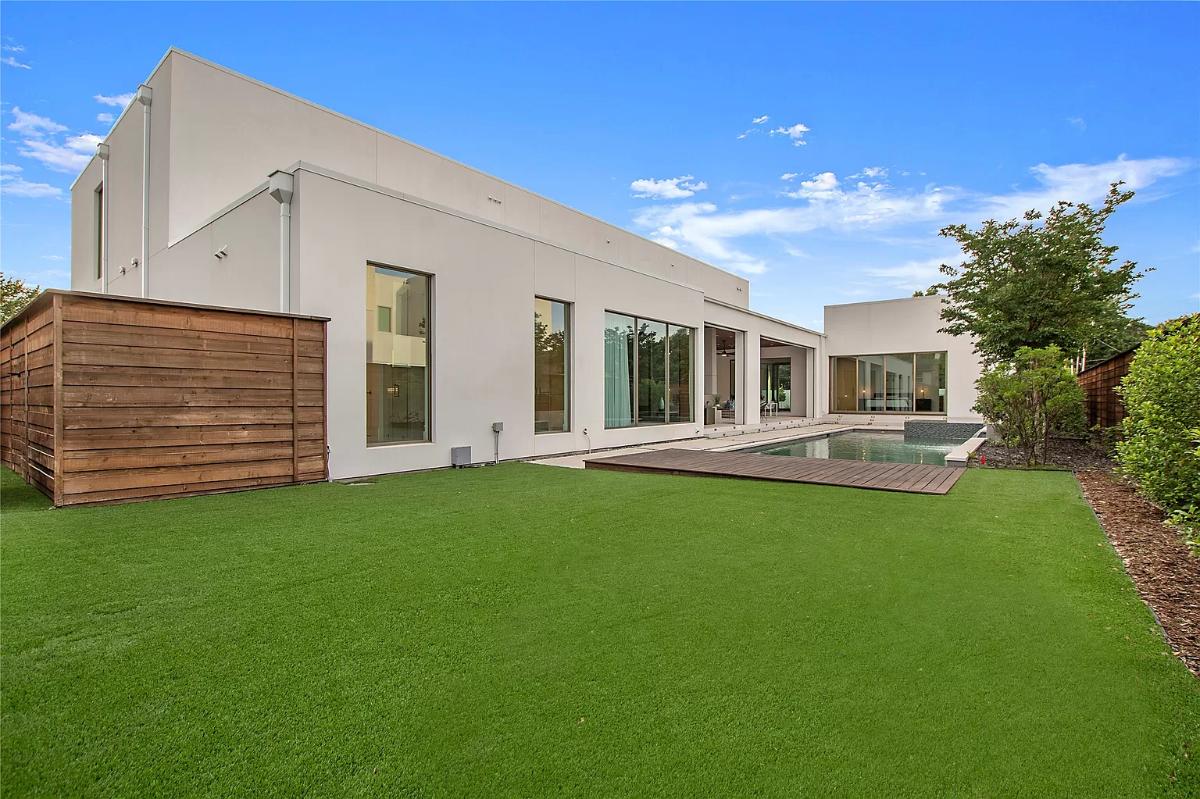 Backyard of the mansion with a pool.