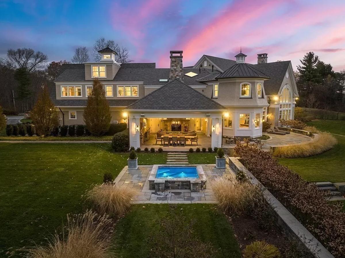 Rear view of the mansion with a pool.
