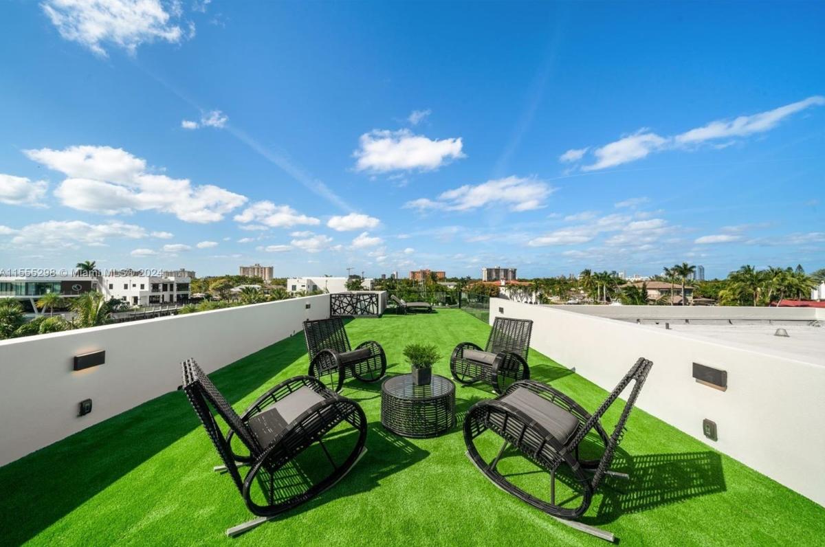 Roof deck with rocking chairs.