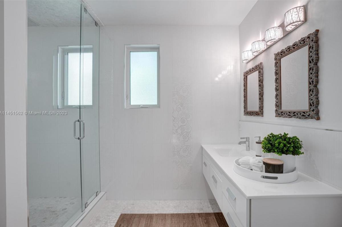 Bathroom with a sink and a walk-in shower.