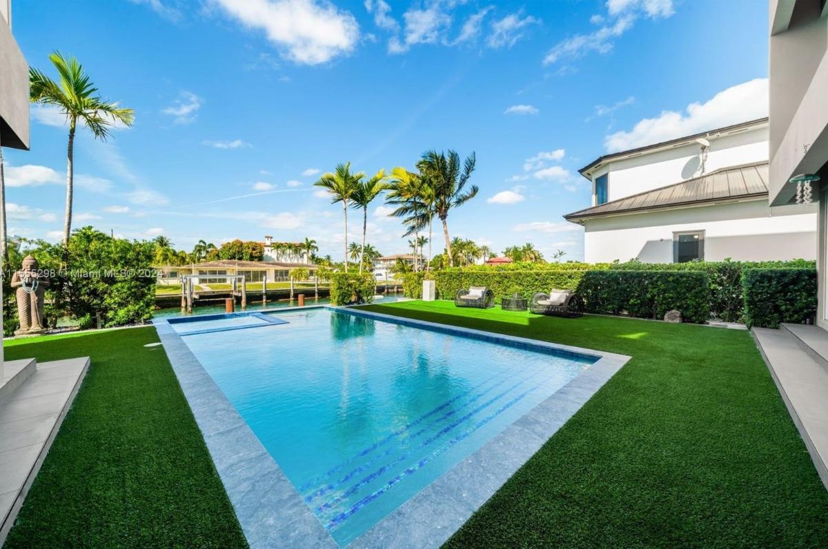 Pool with lounge chairs.