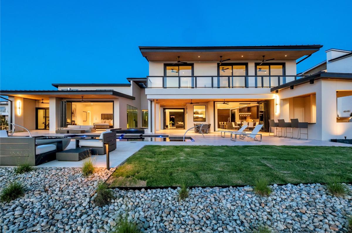 Rear view of the mansion with a pool.