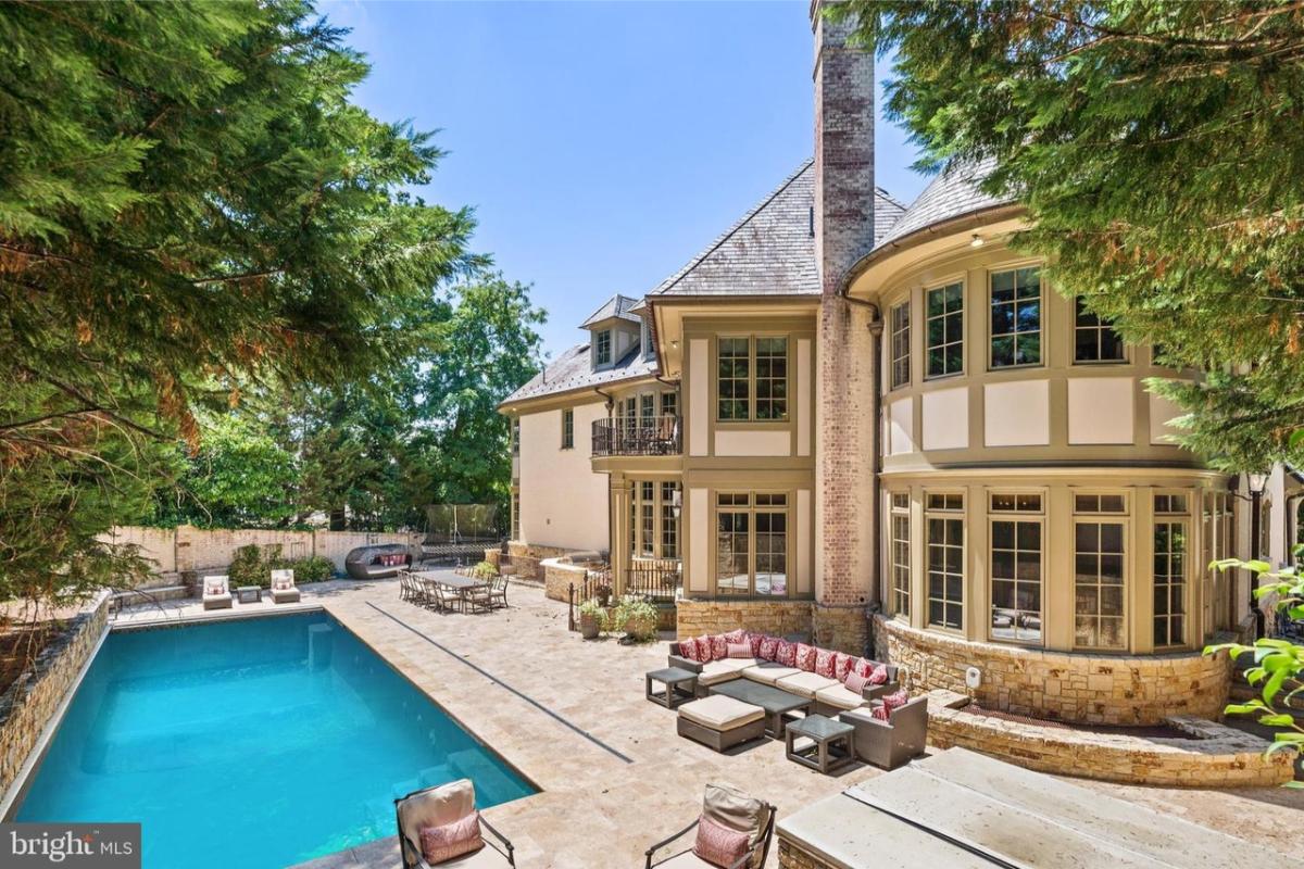 Backyard of the mansion with a pool.