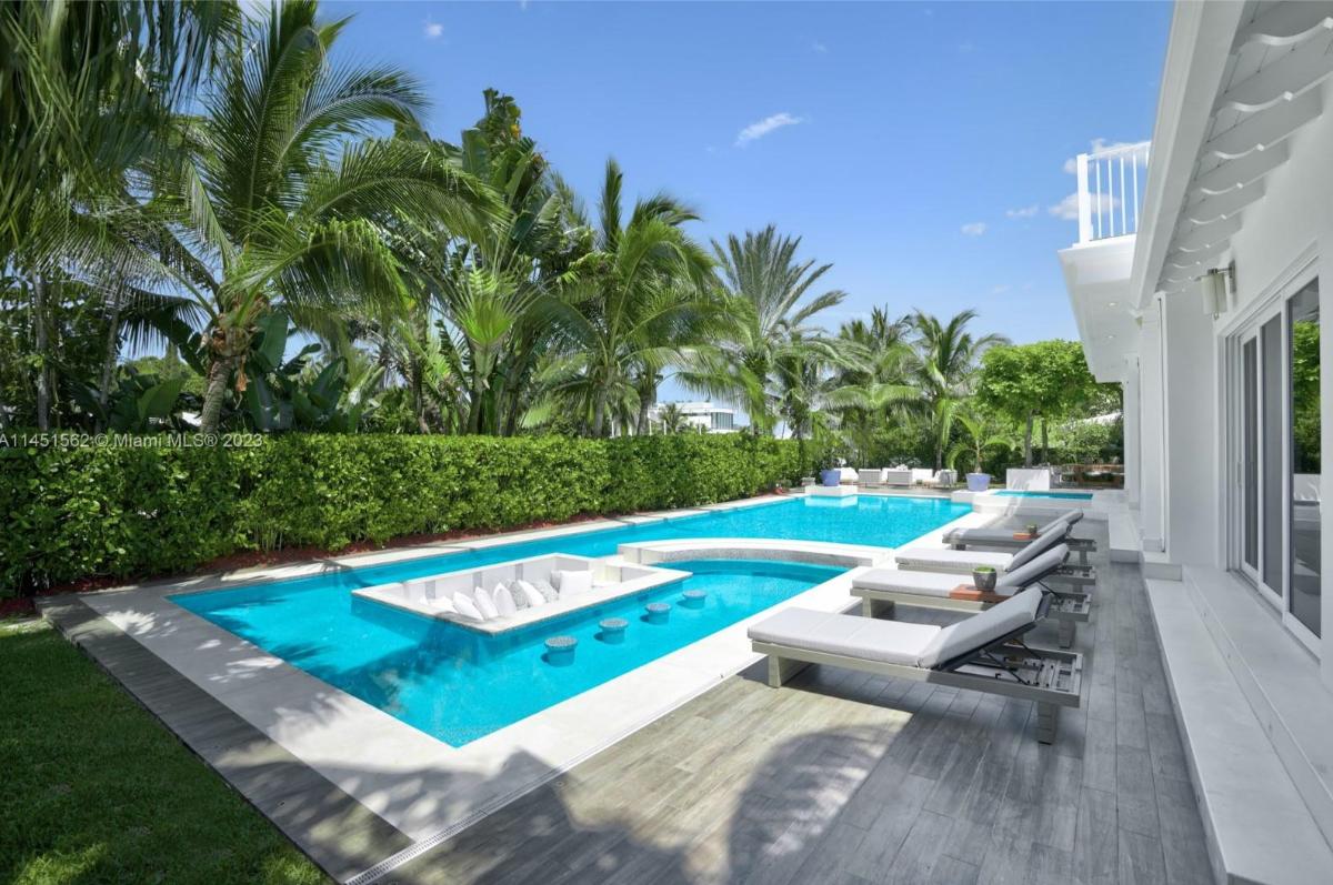 Pool with lounge chairs.
