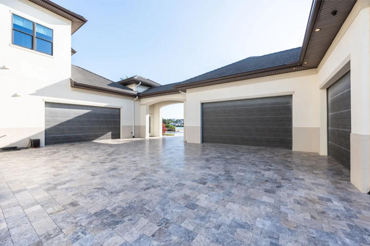 Garage with spacious driveway.