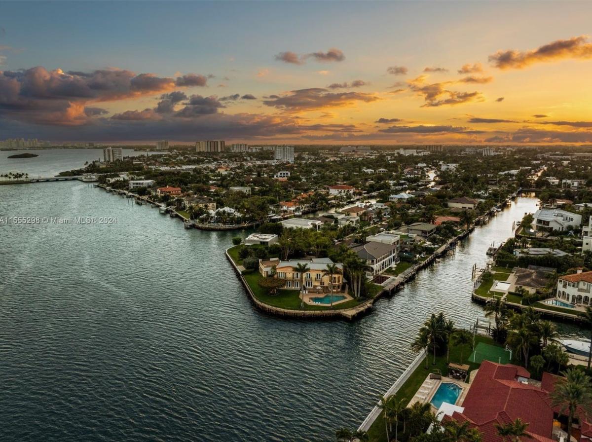 Aerial view of mansion with nearby houses.