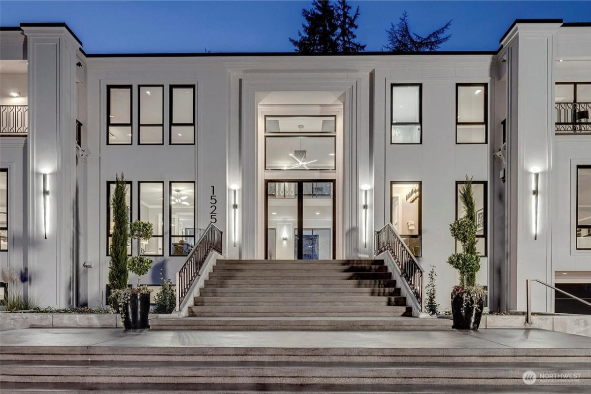 Front entry of the mansion with glass doors.